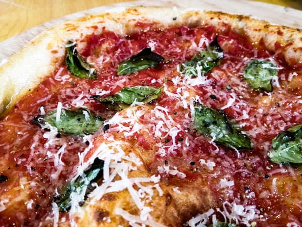Parmesan and Pecorino are the skey ingredients in a Pizza Cossaca
