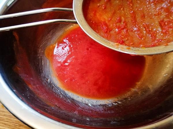 Sieving the tomatoes is key to avoiding a soggy, undercooked pizza