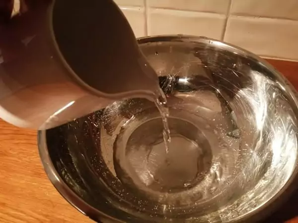 Adding water to pizza dough first is a trick that helps speed up mixing time