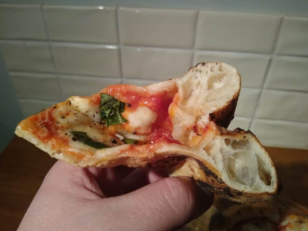 Pizza slice being folded