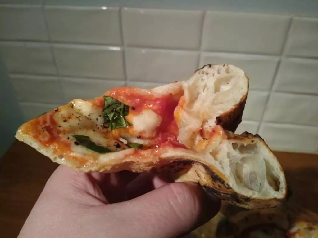 Neapolitan pizza slice being folded