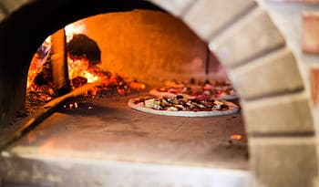 Wood burning in a traditional wood fired oven