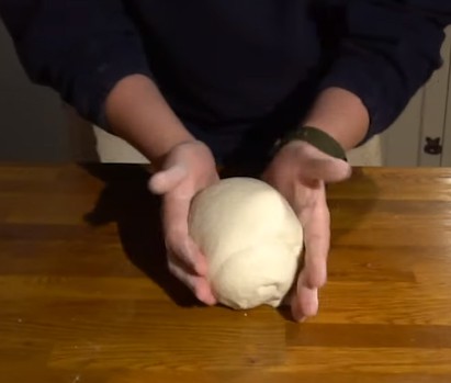 Can you knead pizza dough by hand?
