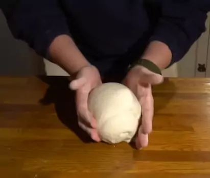 Can you knead pizza dough by hand?