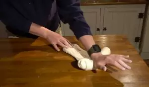 Kneading poolish pizza dough