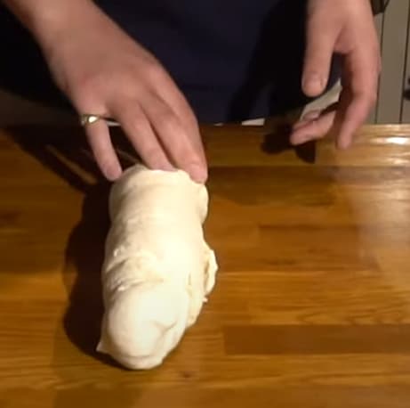 Turn the dough and keep kneading by hand