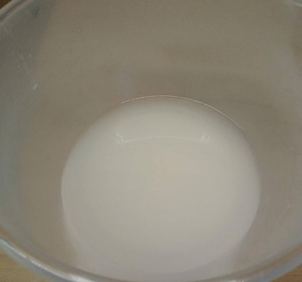 Fresh yeast being activated in a bowl of water