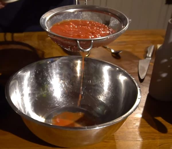 Sieving tomatoes for Neapolitan pizza
