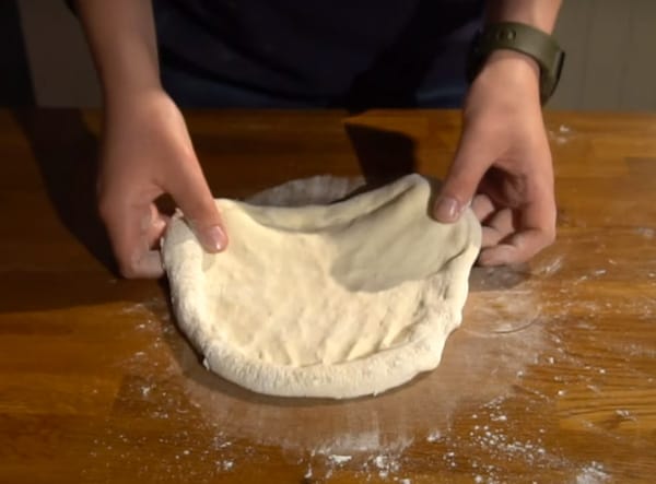 Stretching dough carefully