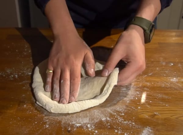 Stretching New York pizza dough