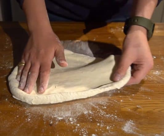Shaping pizza