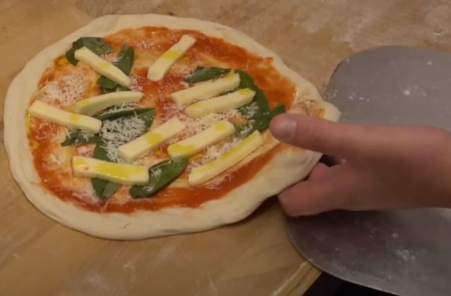 Neapolitan pizza onto peel