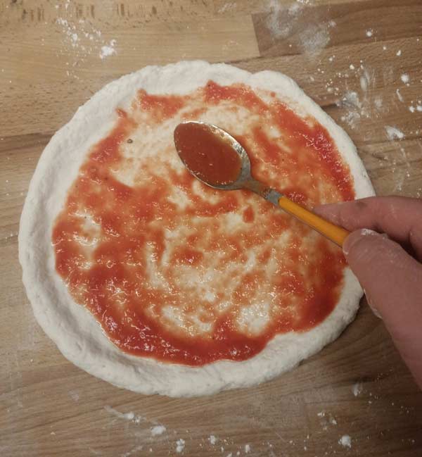 Topping gluten free pizza