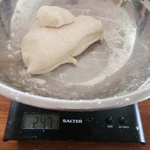 Weighing New York pizza dough
