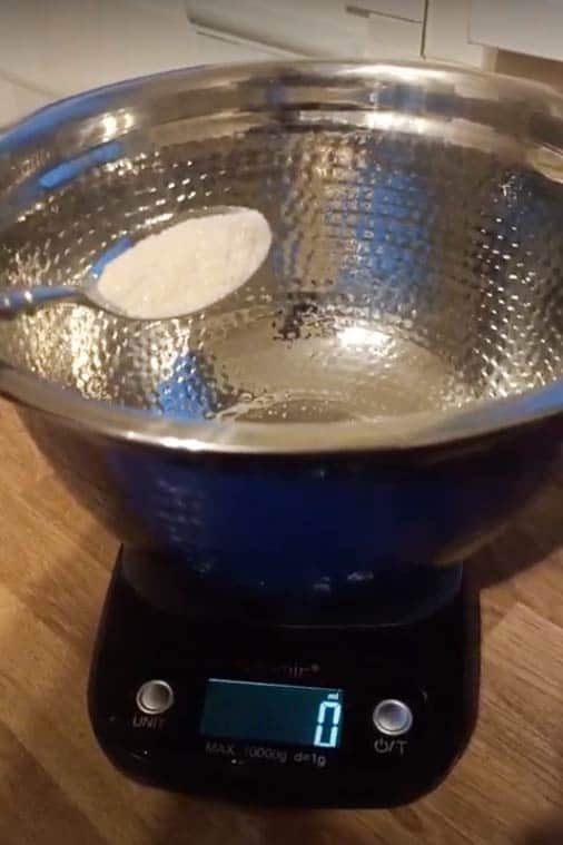 Weighing sugar for New York pizza dough