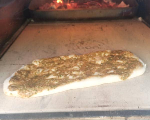Focaccia pizza in wood fired oven