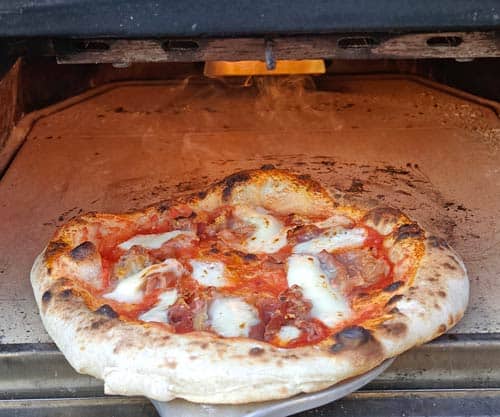 Cooking pizza using peel